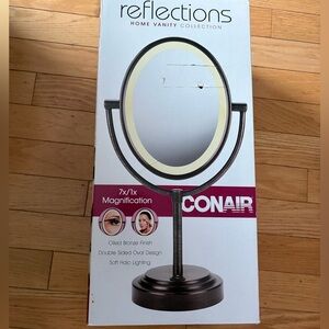 Vanity mirror with lights and magnification